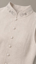 Close-up detail of rhinestone embellished stand collar and buttons