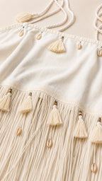 Close-up detail of tassel fringe and seashell embellishments
