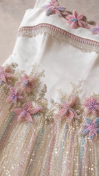 Close-up detail of 3D floral beadwork on bodice