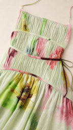 Close-up detail of smocked bodice and floral print on Light Green dress