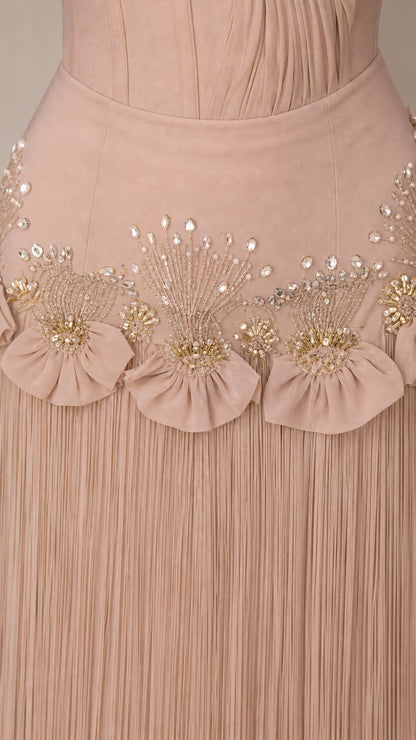 Close-up detail of beaded waist and fringe skirt on Champagne gown