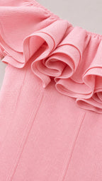 Close-up detail of structured ruffle neckline and fabric texture
