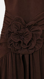 Close-up detail of the 3D fabric rose applique on the waist