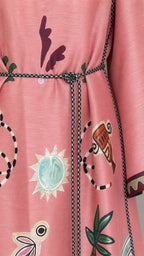 Close-up detail of pink dress print and belt