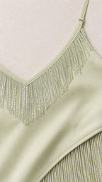 Close-up of mint beaded fringe neckline and pleated detail