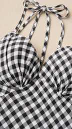 Close-up detail of sweetheart neckline and tie straps on gingham dress